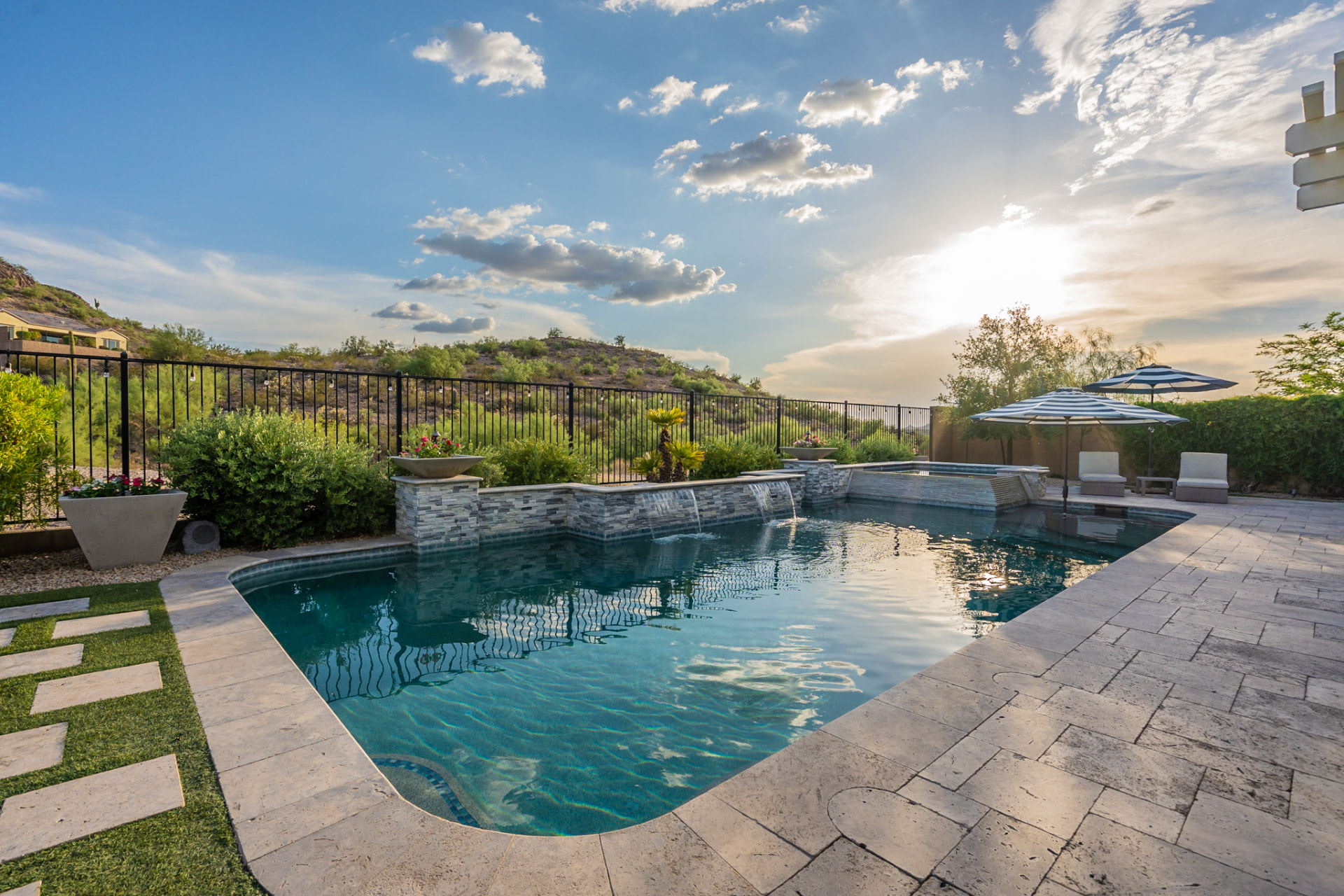 North Peoria backyard pool at sunset with desert mountain views