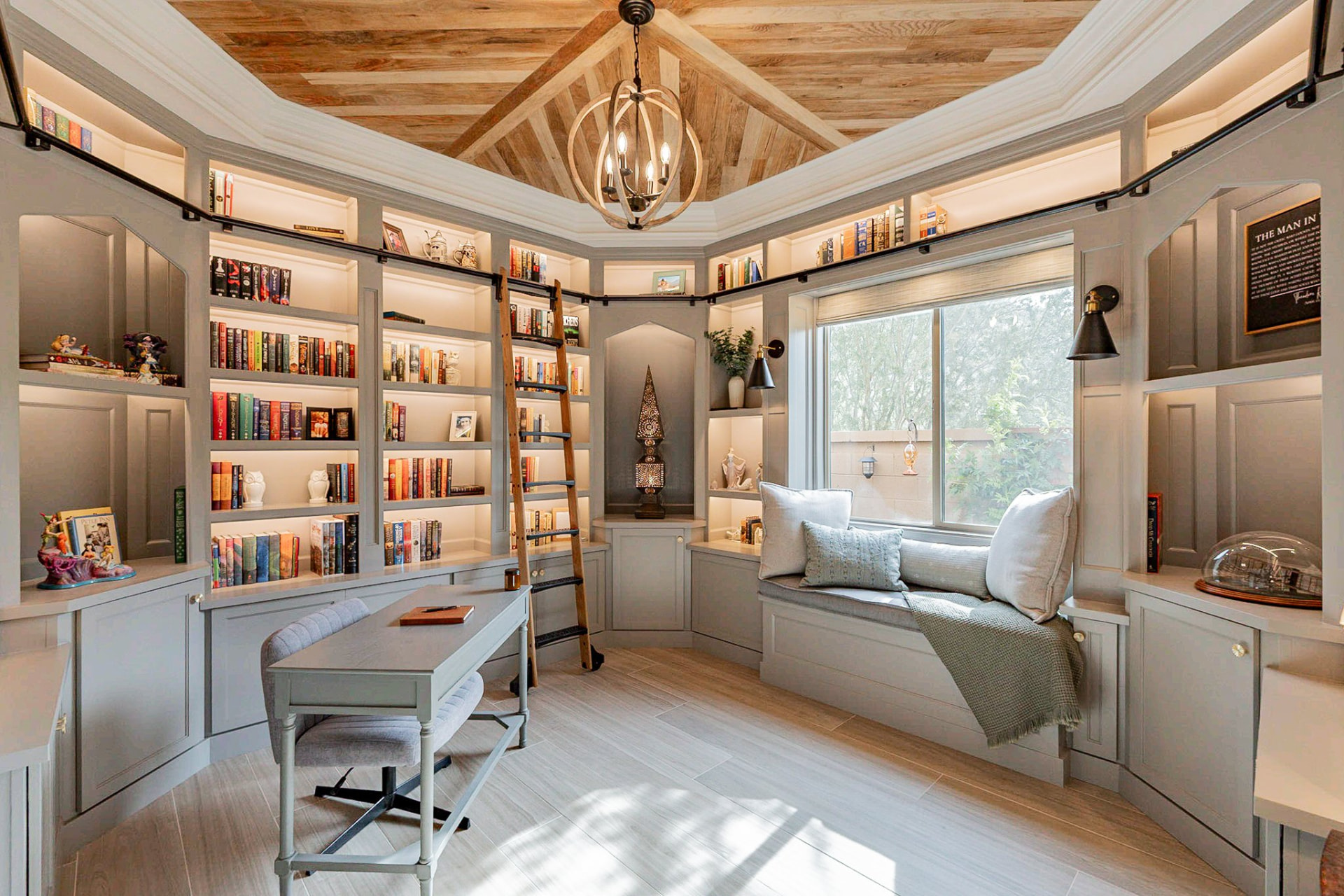 Custom home library with built-in bookshelves and reading nook